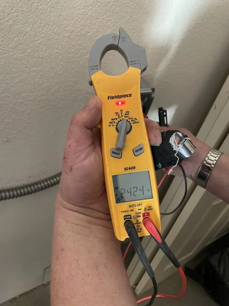 Voltage testing with clamp meter during Outlet Installation in Toronto
